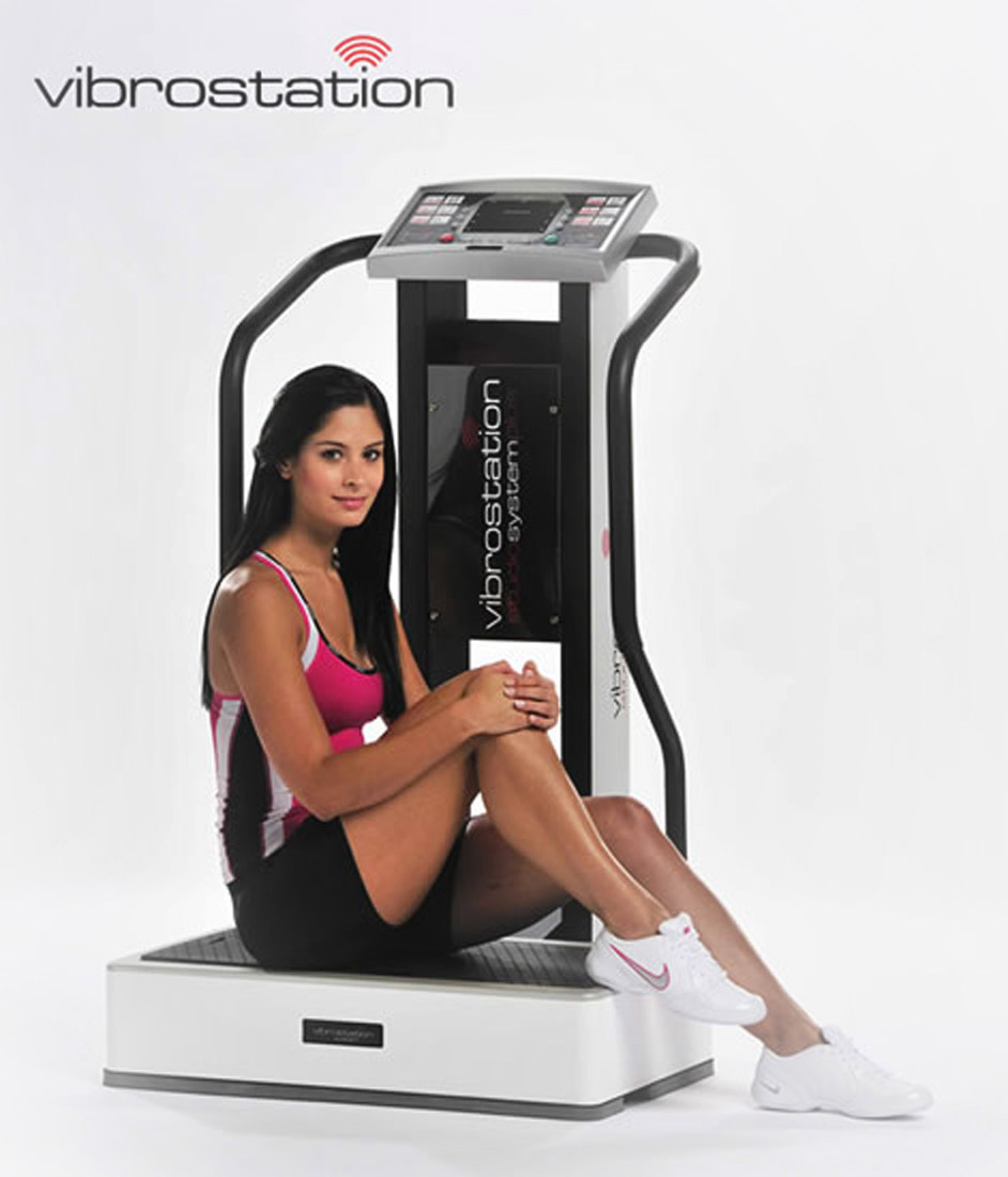 Woman Sits on Vibration Training Machine